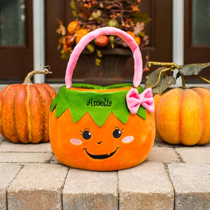 Create a custom trick-or-treat bag with a bow for a girl with their own name