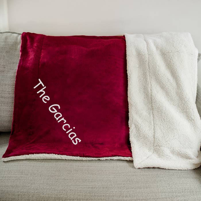 Warm and cozy sherpa blanket embroidered with custom text